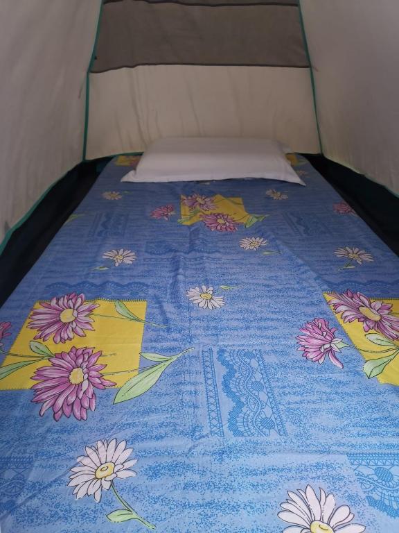Postel nebo postele na pokoji v ubytování El Nido Beach Camp