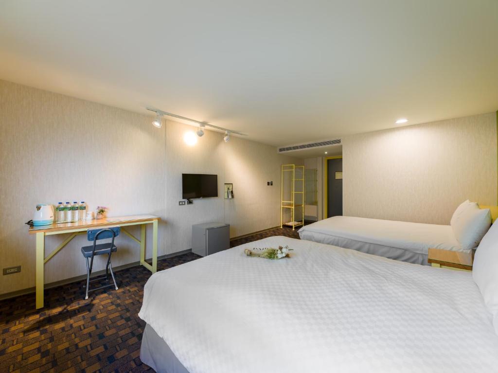 Postel nebo postele na pokoji v ubytování LaVita Hotel