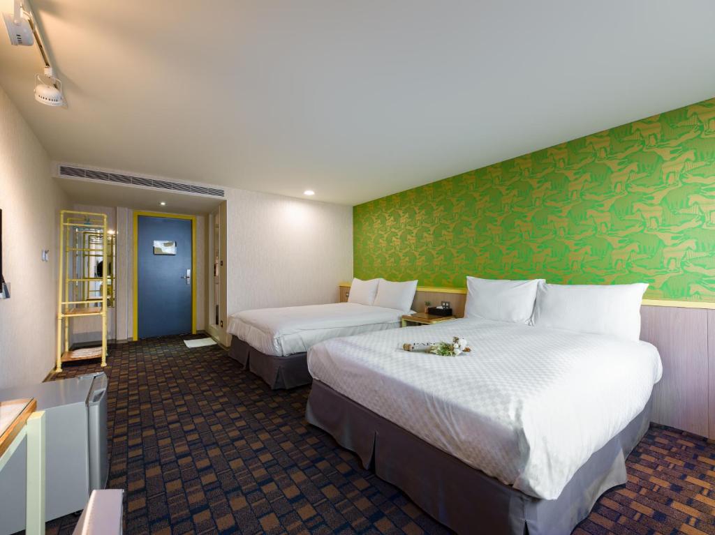 Postel nebo postele na pokoji v ubytování LaVita Hotel