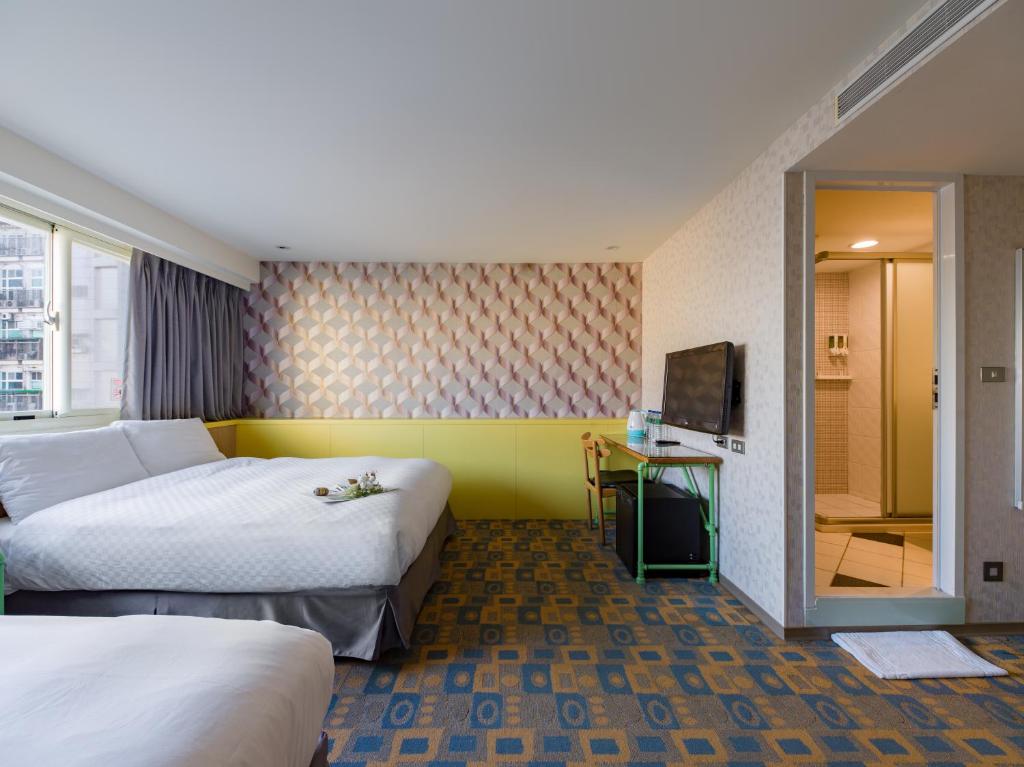 Postel nebo postele na pokoji v ubytování LaVita Hotel