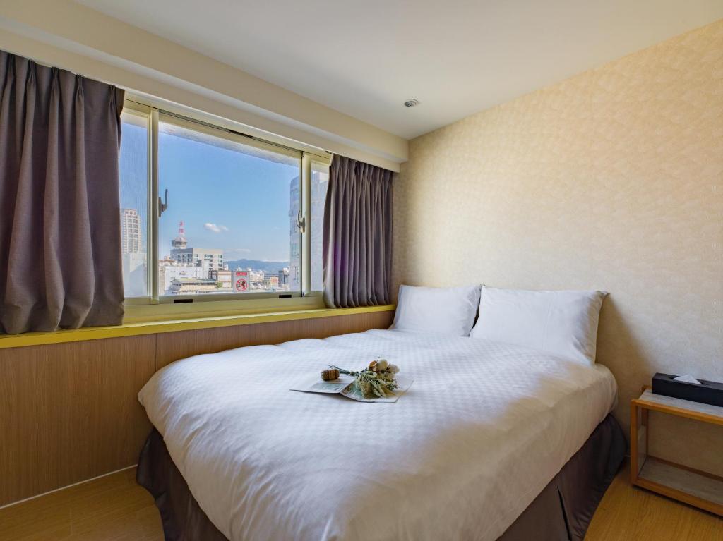 Postel nebo postele na pokoji v ubytování LaVita Hotel