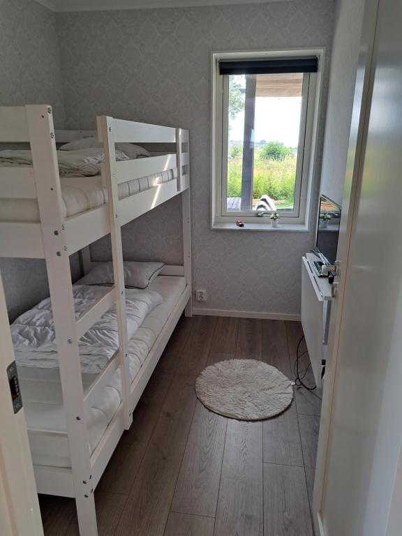 Postel nebo postele na pokoji v ubytování Tångaberg, Varberg