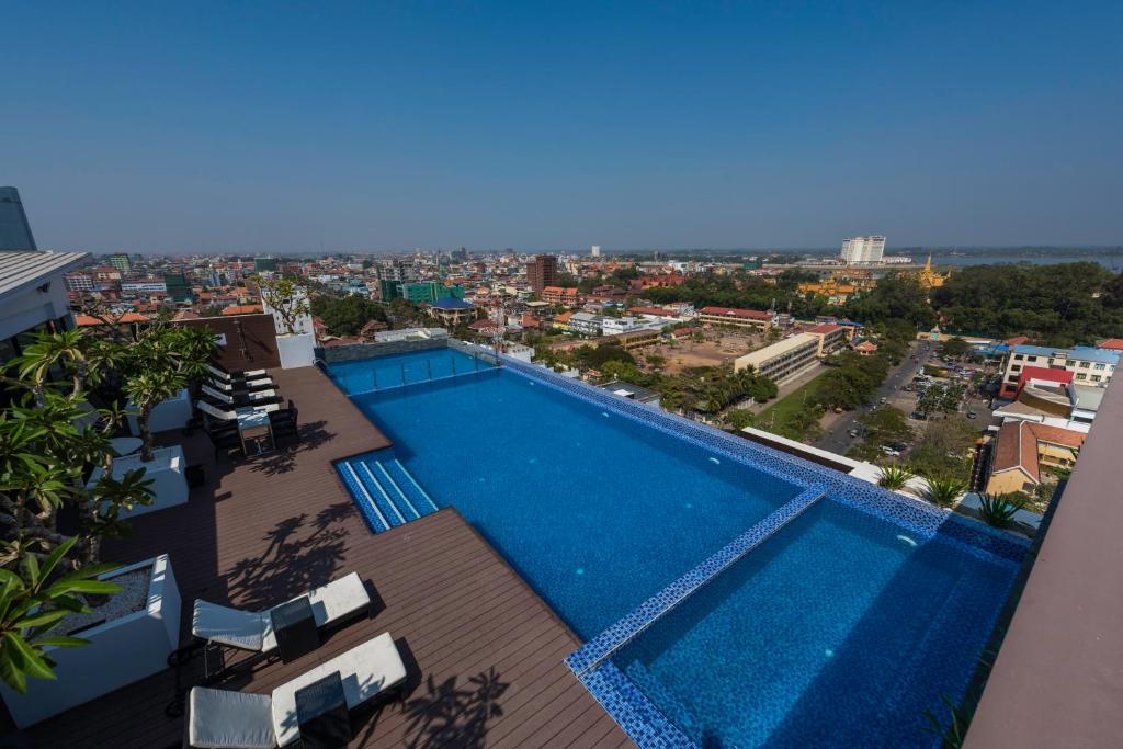 a swimming pool on the roof of a building at Maline Exclusive Serviced Apartments in Phnom Penh
