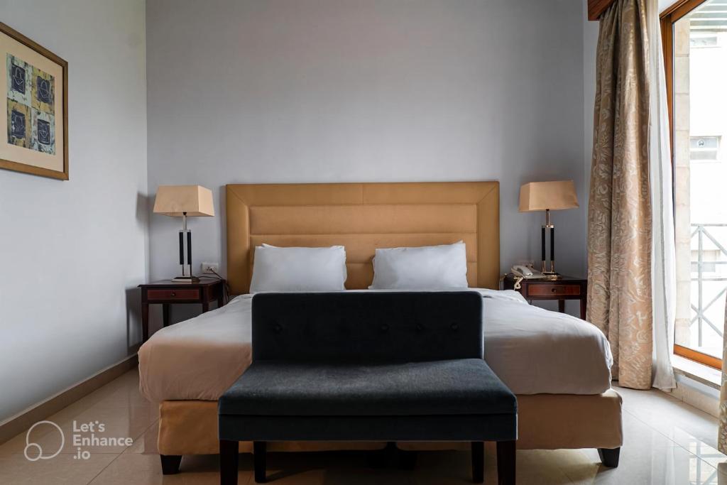 Ένα ή περισσότερα κρεβάτια σε δωμάτιο στο Guest House Hotel Amman by FHM