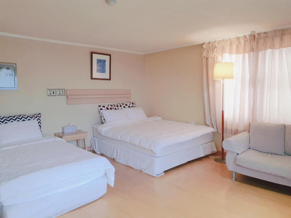 Postel nebo postele na pokoji v ubytování Hotel Good Inn
