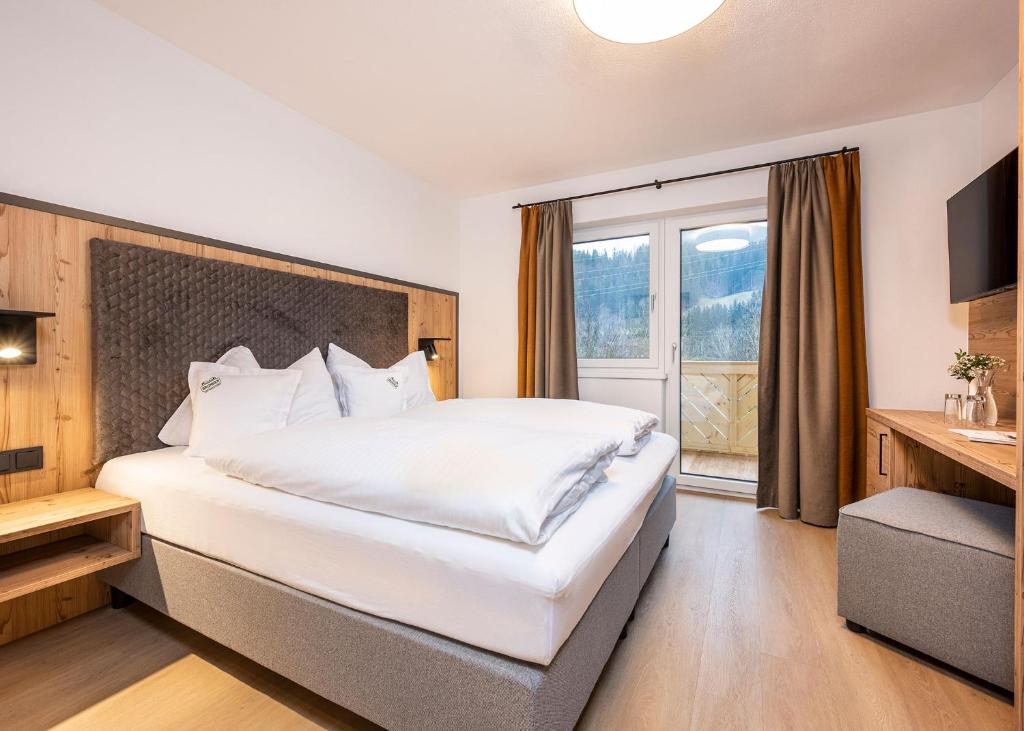 Postel nebo postele na pokoji v ubytování Hotel Brunner - Reiteralm