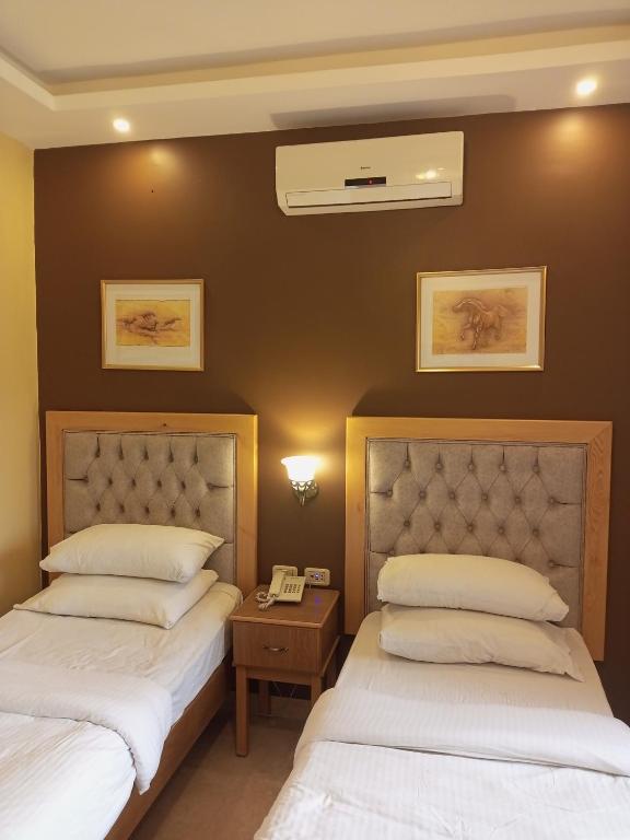 Postel nebo postele na pokoji v ubytování Mariam Hotel