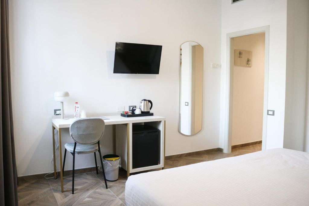 Postel nebo postele na pokoji v ubytování Hotel Donatello
