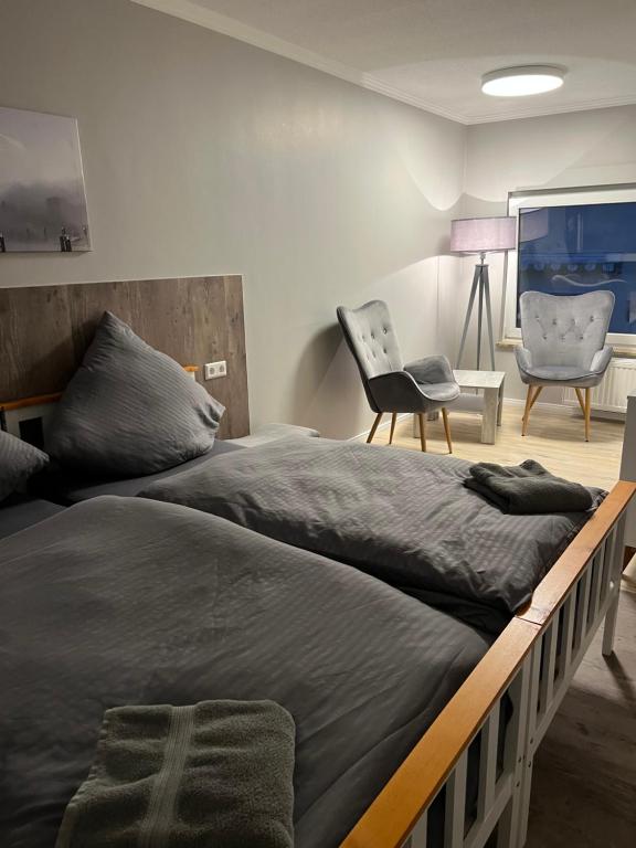 Postel nebo postele na pokoji v ubytování Pension am Schrotturm Tangermünde