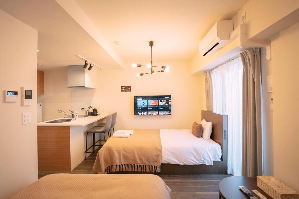 Postel nebo postele na pokoji v ubytování 谷町君HOTEL 心斎橋東32