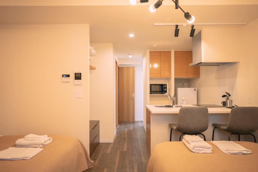 Kuchyň nebo kuchyňský kout v ubytování 谷町君HOTEL 心斎橋東32