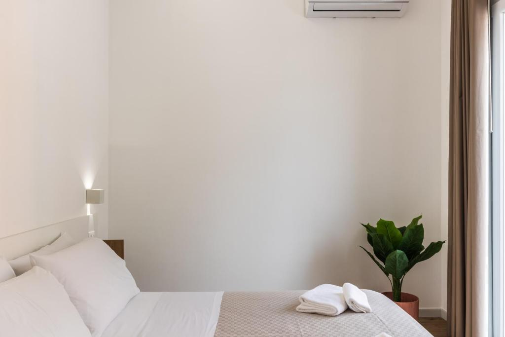 Łóżko lub łóżka w pokoju w obiekcie Trisina Rooms