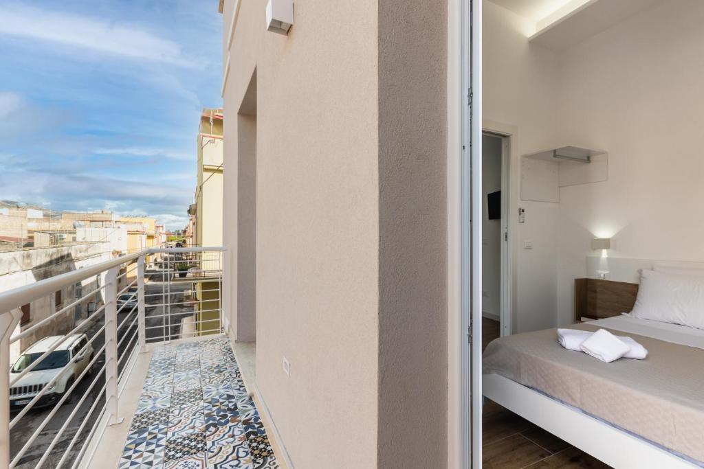 Łóżko lub łóżka w pokoju w obiekcie Trisina Rooms