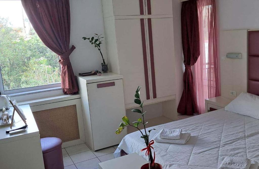 Postel nebo postele na pokoji v ubytování Bicorna - Chania