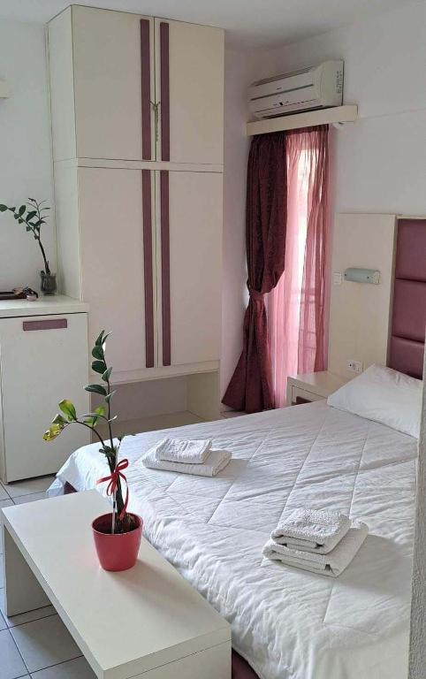 Postel nebo postele na pokoji v ubytování Bicorna - Chania