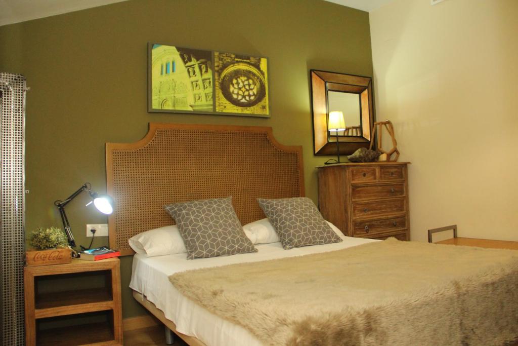 Postel nebo postele na pokoji v ubytování Apartamentos Alcazar de Baeza