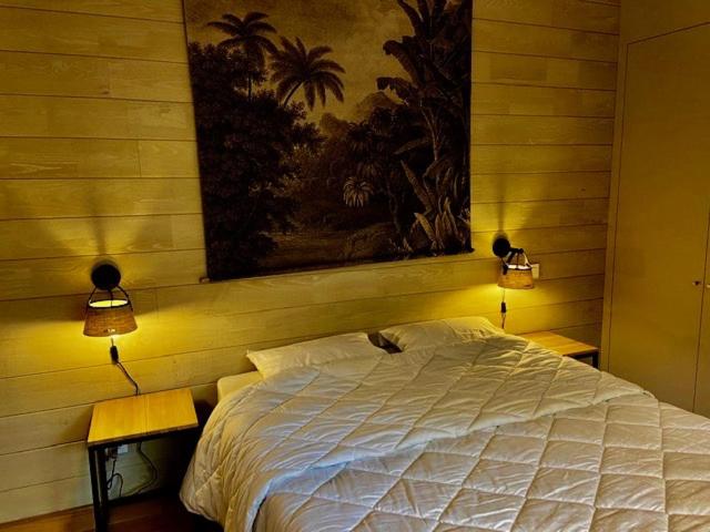 Tempat tidur dalam kamar di Grand Chalet de Pitrot