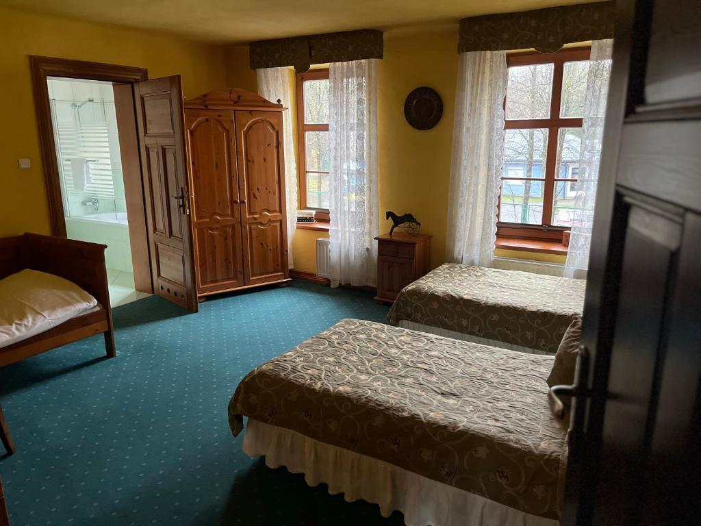 Postel nebo postele na pokoji v ubytování Gościniec Zamkowy
