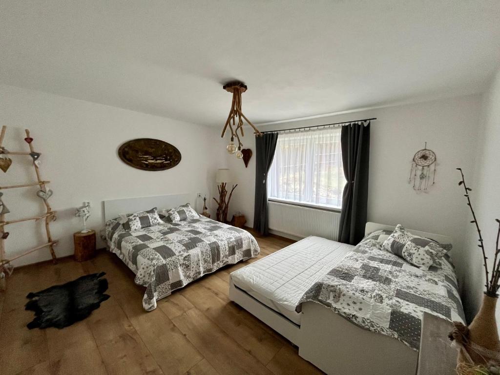 Postel nebo postele na pokoji v ubytování Apartmánový dom Adas
