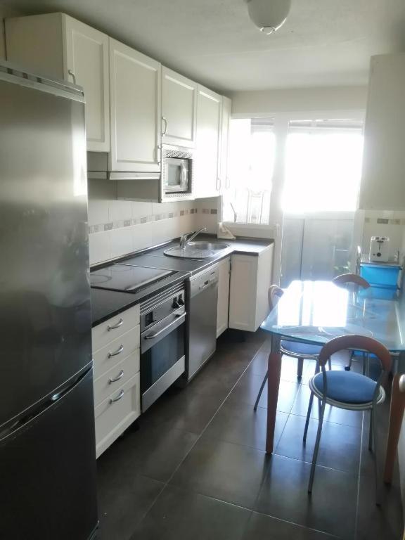Kuchyň nebo kuchyňský kout v ubytování Apartamento Pepe