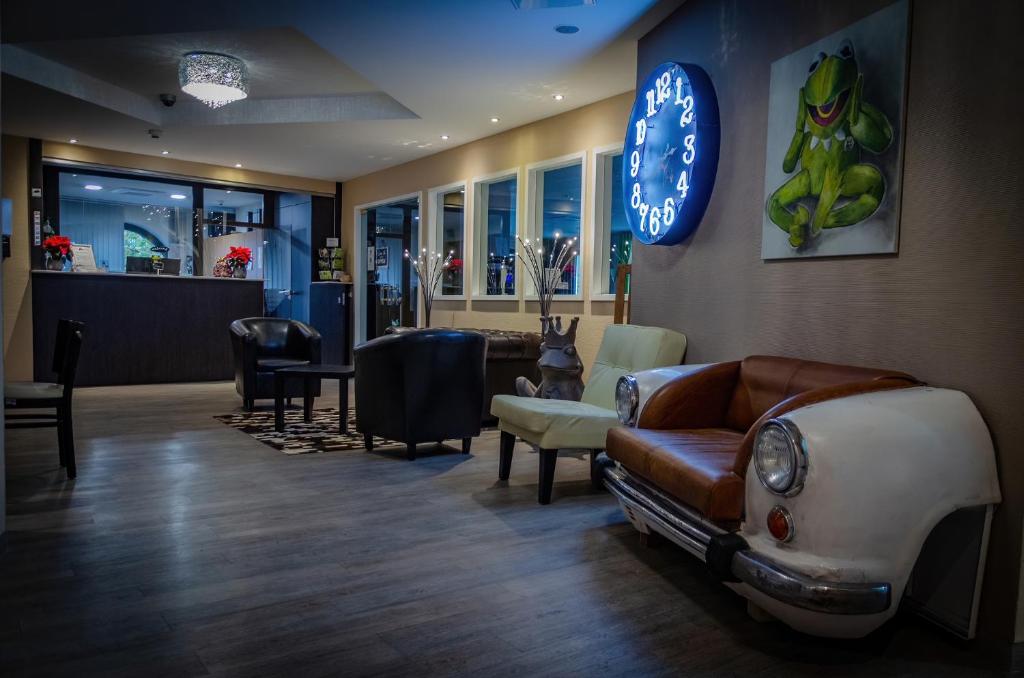 a living room with a car on the wall at Hotel Aulmann in Trier