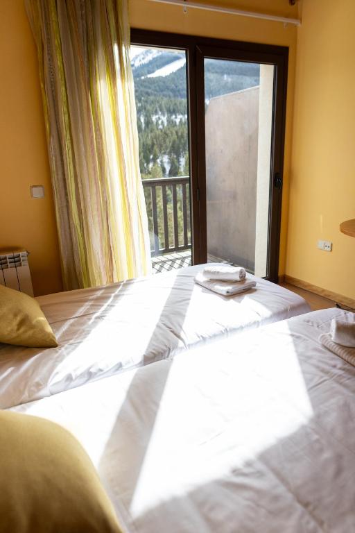 Postel nebo postele na pokoji v ubytování Hotel Golf Natura