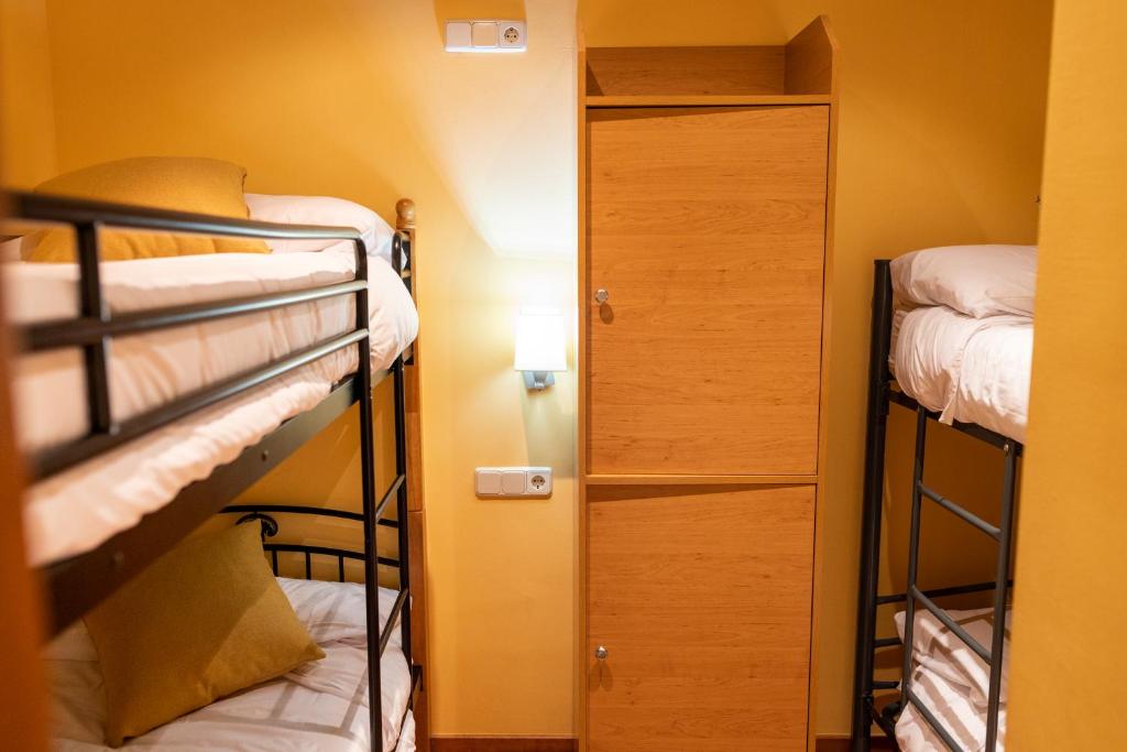 Postel nebo postele na pokoji v ubytování Hotel Golf Natura
