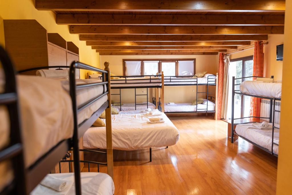 Postel nebo postele na pokoji v ubytování Hotel Golf Natura