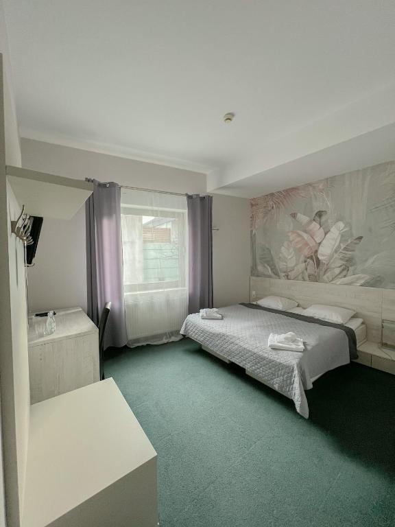 Postel nebo postele na pokoji v ubytování Hotel Poleski