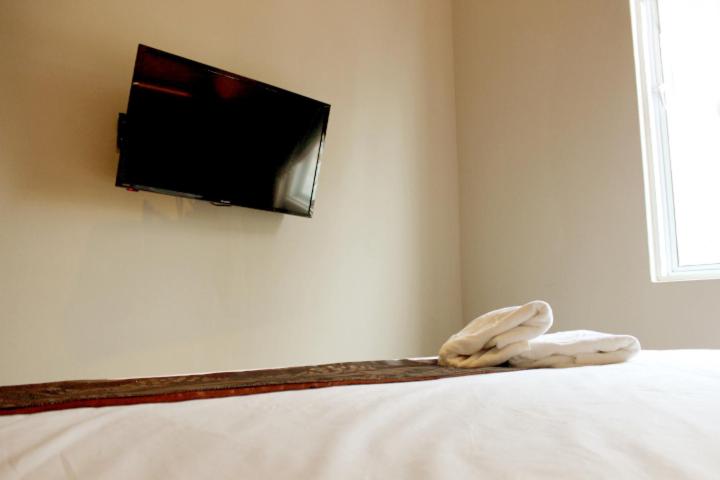 TV a/nebo společenská místnost v ubytování Art Cottage Hotel