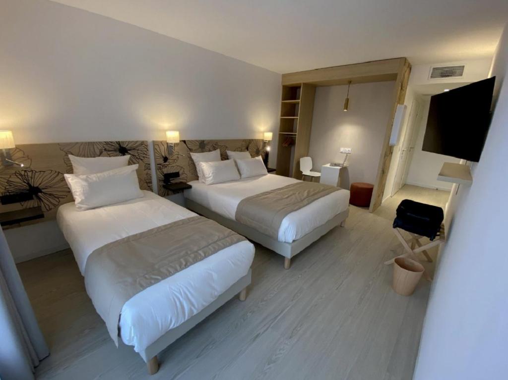 Letto o letti in una camera di COURRIER SUD
