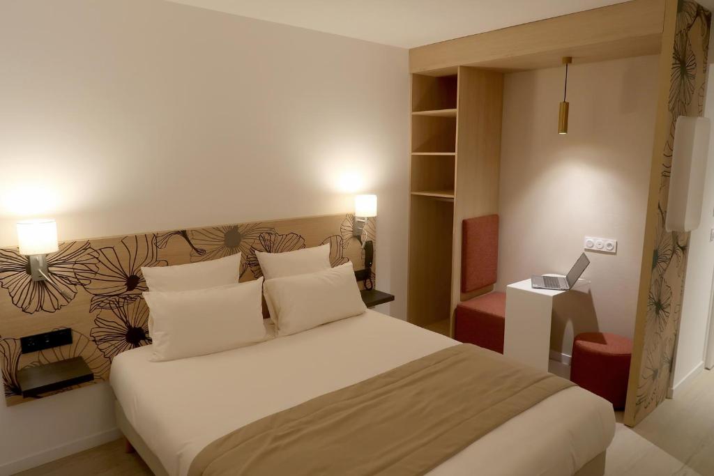Letto o letti in una camera di COURRIER SUD