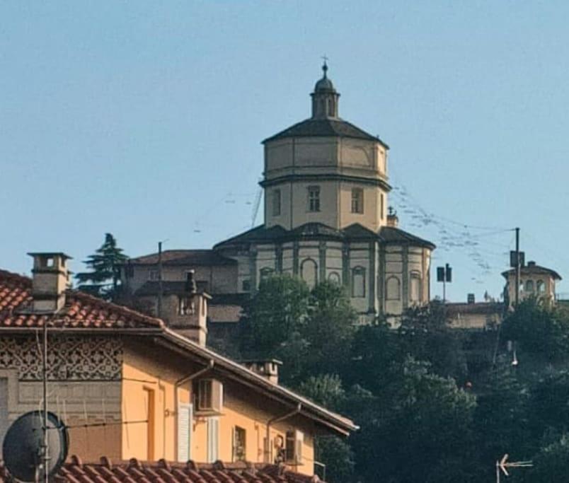 a large building on top of a hill at La finestra sui Cappuccini in Turin