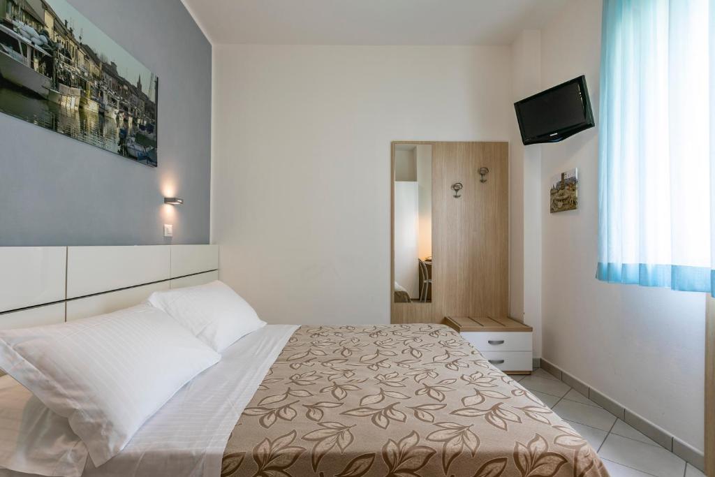 Postel nebo postele na pokoji v ubytování Hotel Baya - in centro, sul mare