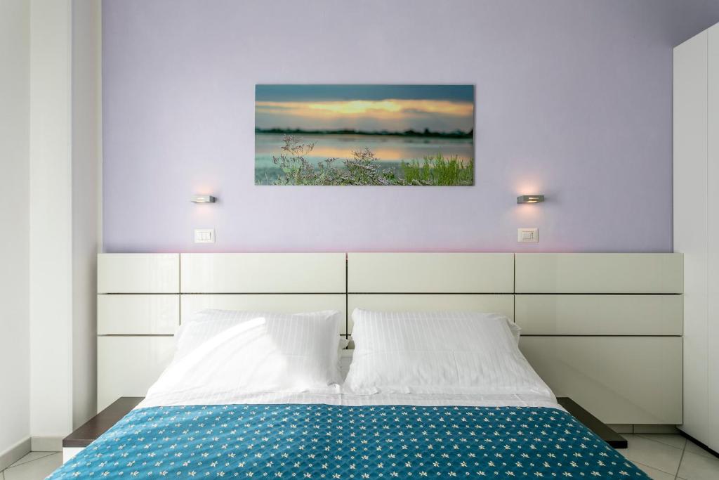 Postel nebo postele na pokoji v ubytování Hotel Baya - in centro, sul mare