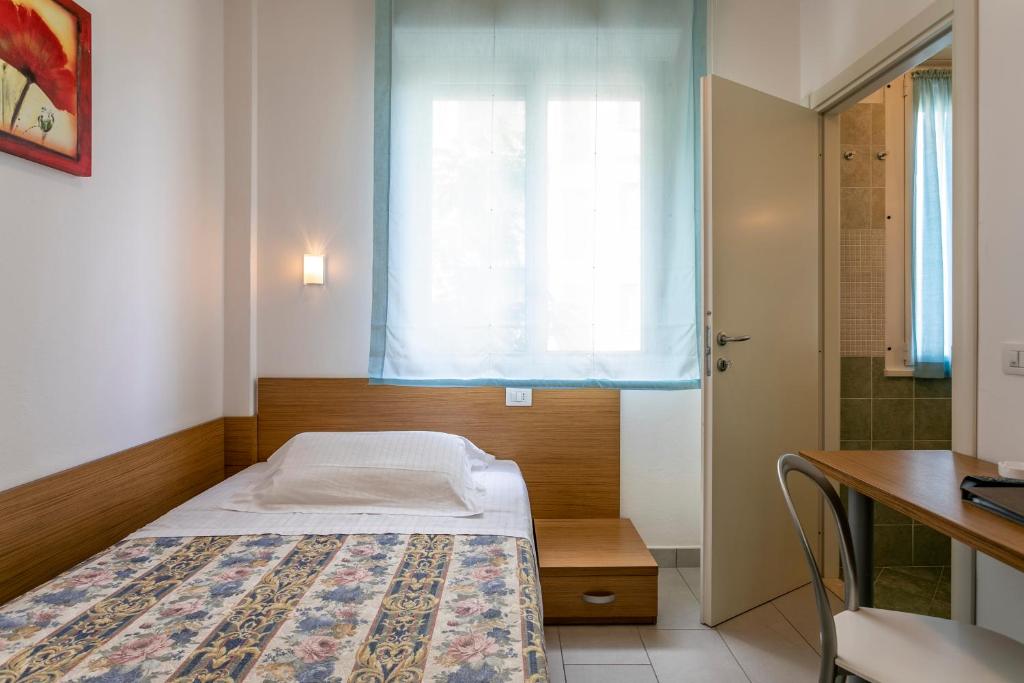 Postel nebo postele na pokoji v ubytování Hotel Baya - in centro, sul mare