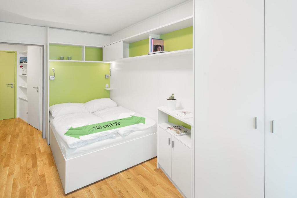 Postel nebo postele na pokoji v ubytování myNext - Hotel Leo
