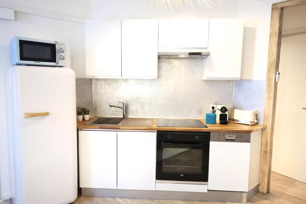 Una cocina o zona de cocina en Appartements Premium en Hyper Centre Ville