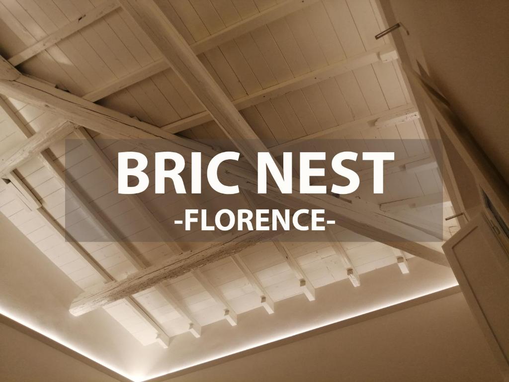 eine weiße Decke mit den Worten Backstein als nächster Fluoreszenz in der Unterkunft BRIC NEST il luogo ideale per la tua vacanza. in Florenz