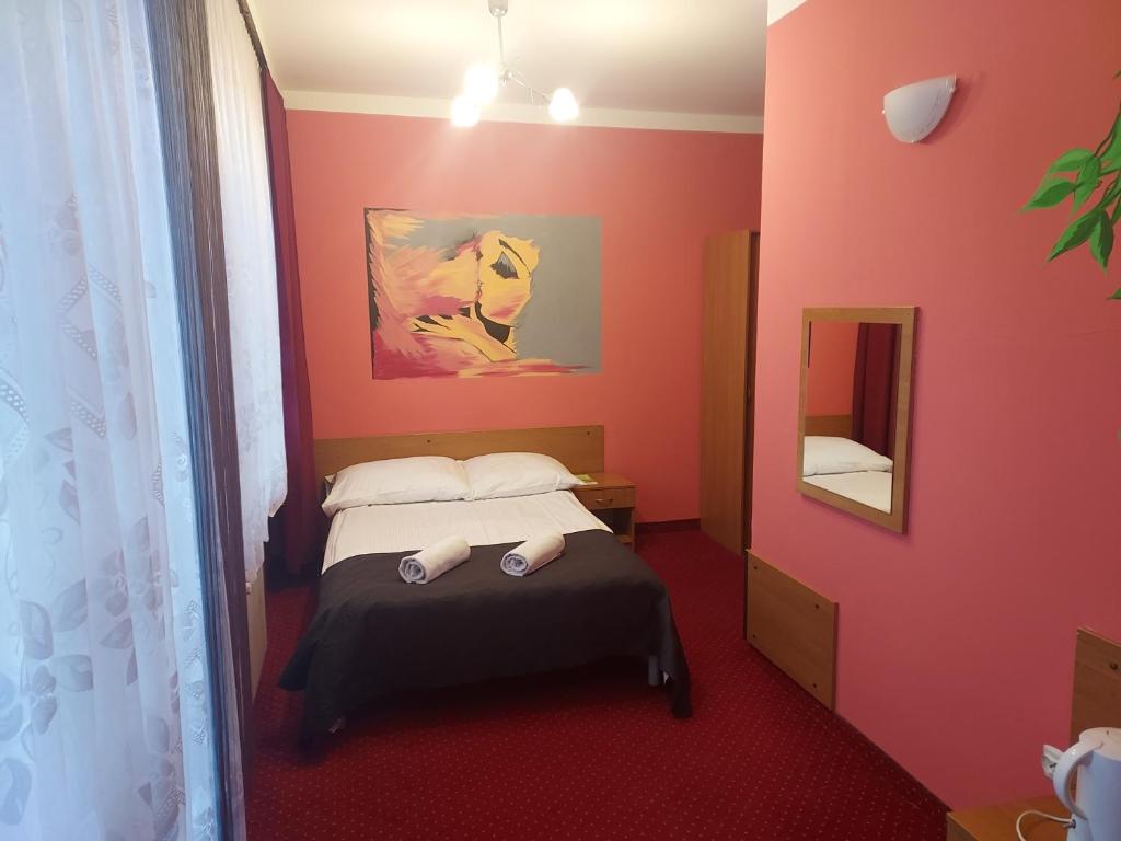 Postel nebo postele na pokoji v ubytování Rezydencja Izabella