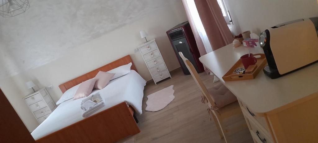 Postel nebo postele na pokoji v ubytování CASA CASEROTTE
