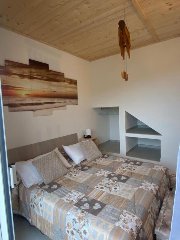 A bed or beds in a room at Monolocale V.M 0.23