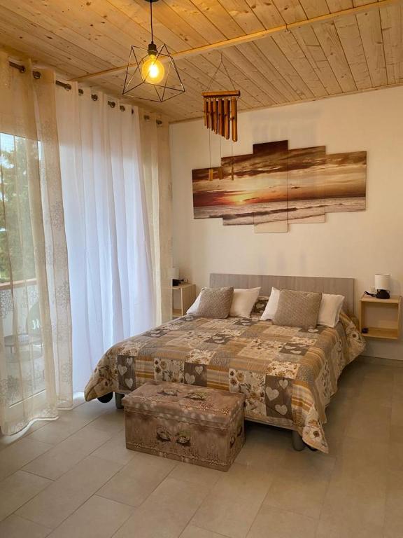 A bed or beds in a room at Monolocale V.M 0.23