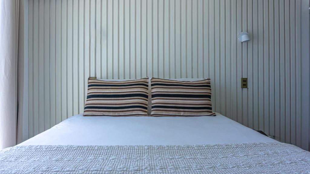 Postel nebo postele na pokoji v ubytování Dei Templi Apart Hotel