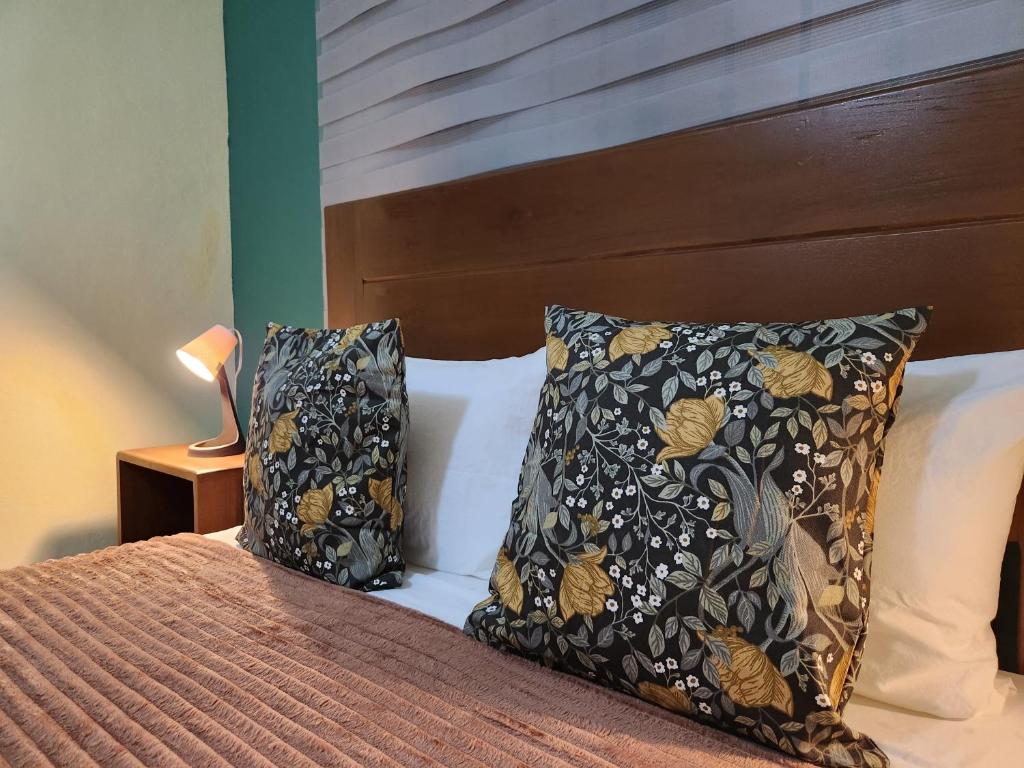 Postel nebo postele na pokoji v ubytování Hotel La Casona MC