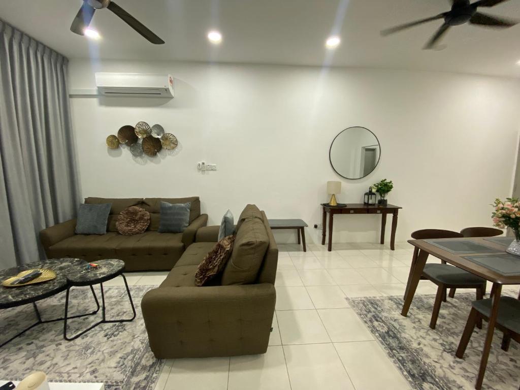 a living room with a couch and a table at The Vista Apartment @ Demak Laut in Kuching