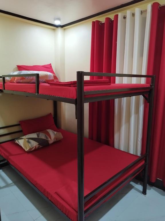 Postel nebo postele na pokoji v ubytování 30pax-Jumongs Transient Inn