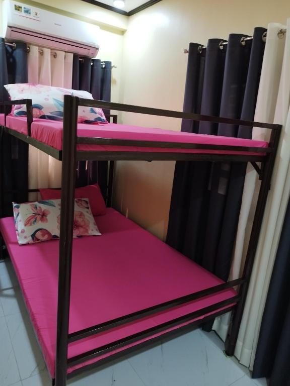 Postel nebo postele na pokoji v ubytování 30pax-Jumongs Transient Inn