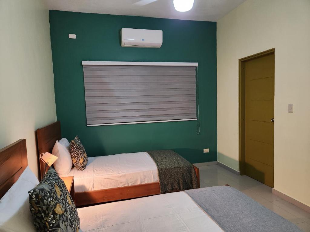Postel nebo postele na pokoji v ubytování Hotel La Casona MC