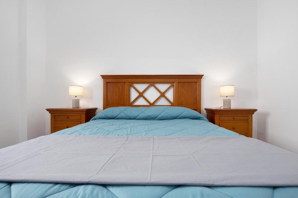 A bed or beds in a room at Casa Mela
